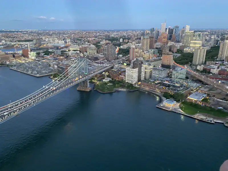 The Brooklyn waterfront and a bridge over the East River from above